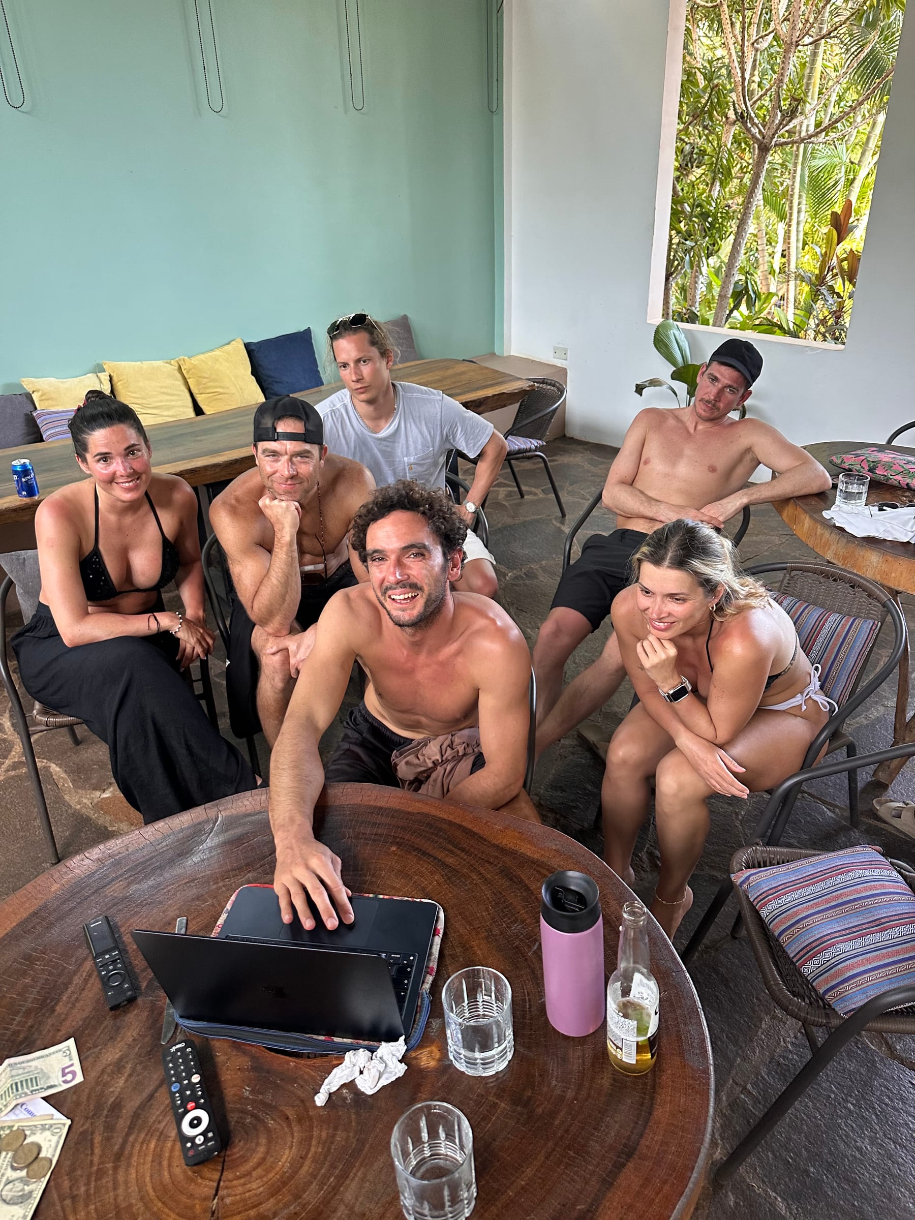 SurfXplore guests gathered around a table at the surf camp in El Salvador