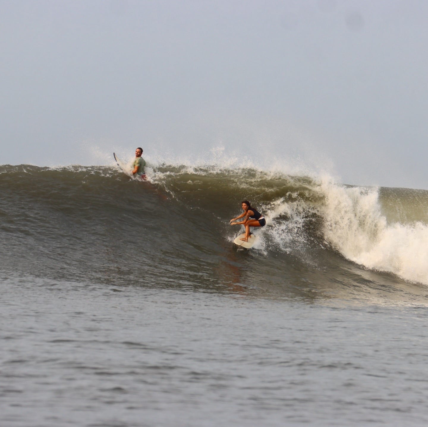 Surfer dropping into a powerful wave in El Salvador