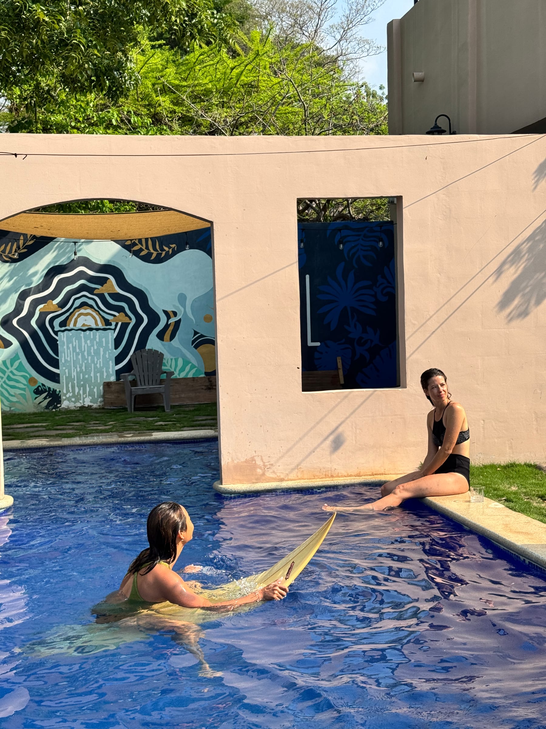 Guests practicing board control in the pool at the El Salvador surf camp