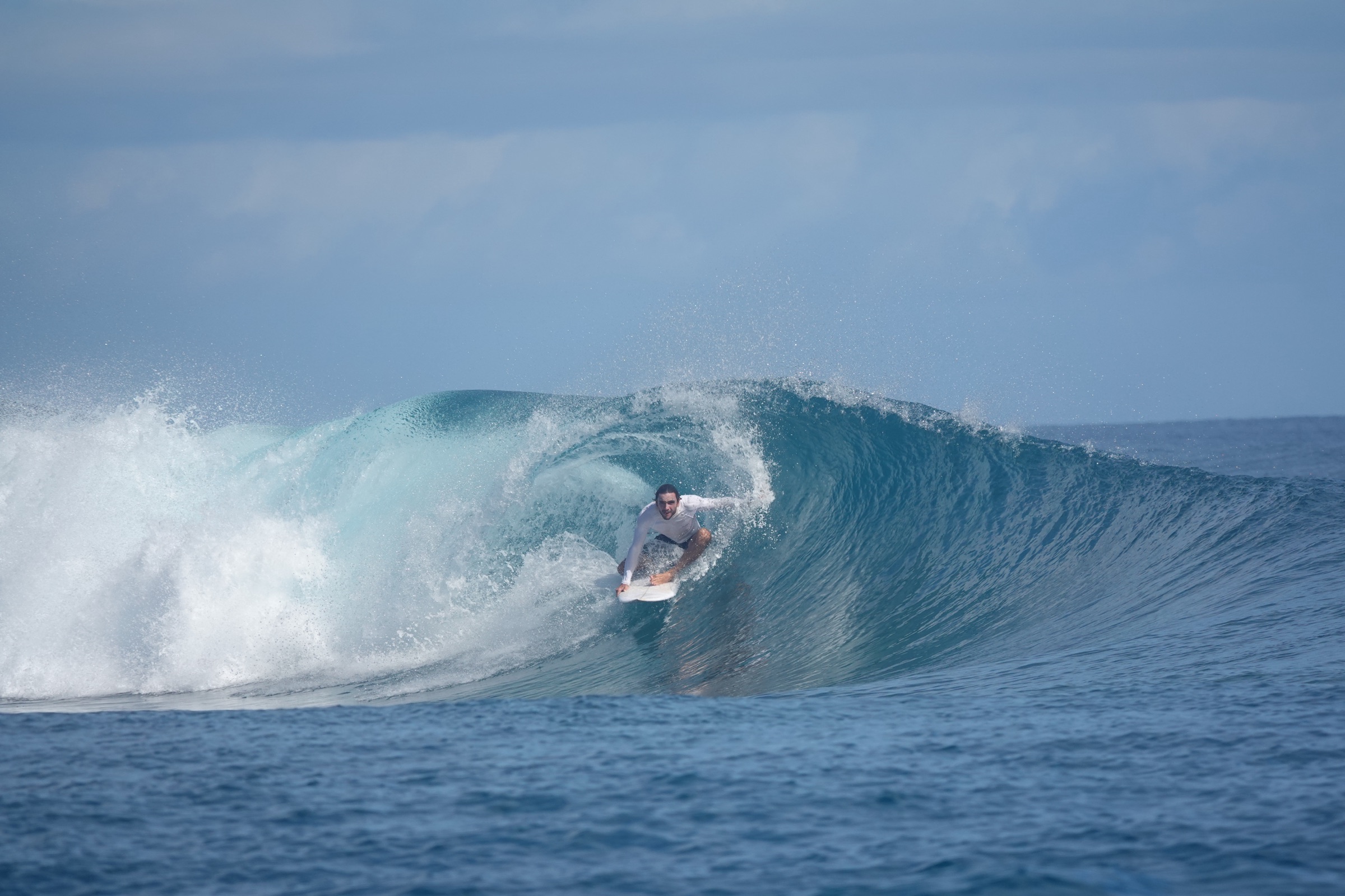 Mentawai island coastline and tropical jungle behind the surf