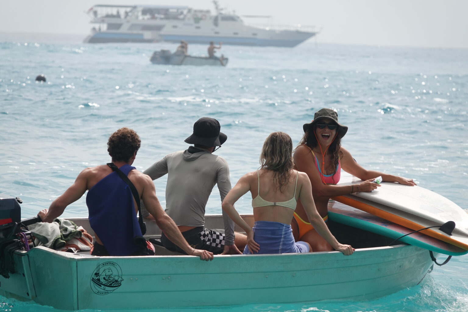 A surfer riding a clean wave during a SurfXplore coaching lesson.